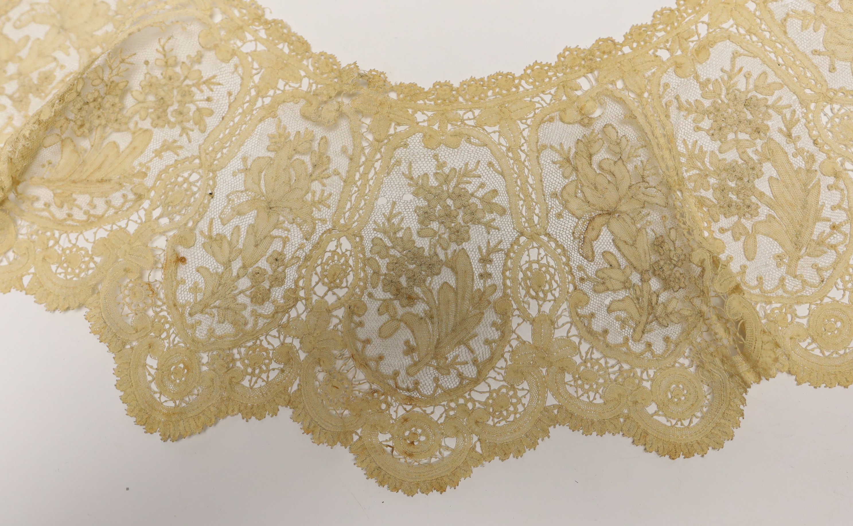 A long 19th century mixed Brussels lace collar, with 20 needle lace oval insertions, a similar wider Honiton bobbin lace collar and a machine lace bonnet veil